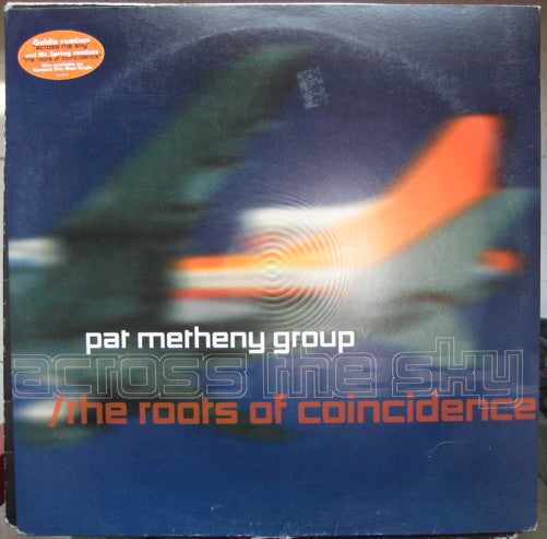 Across The Sky / The Roots Of Coincidence (GOLDIE) | Excellent+ (EX+) Excellent (EX) Get Cheap Vinyl