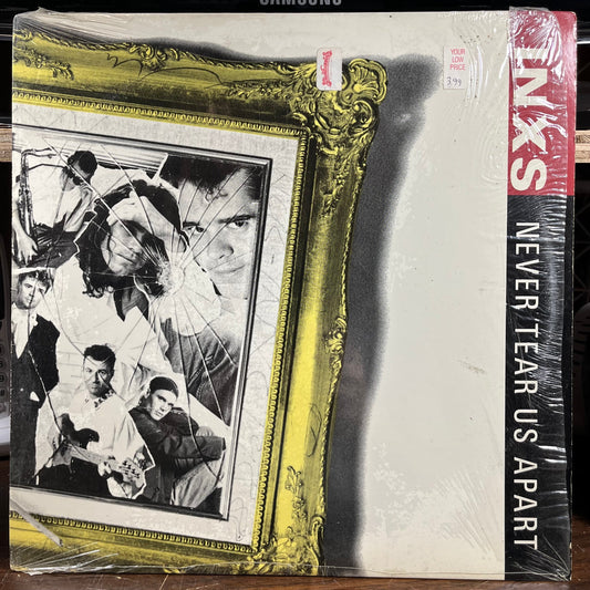 Never Tear Us Apart (VINYL) | Very Good Plus (VG+) Near Mint (NM) Get Cheap Vinyl
