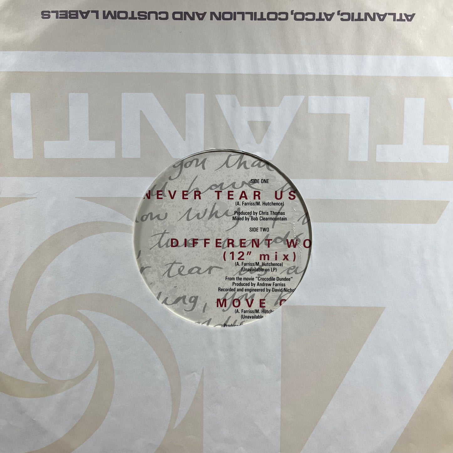 Never Tear Us Apart (VINYL) | Very Good Plus (VG+) Near Mint (NM) Get Cheap Vinyl
