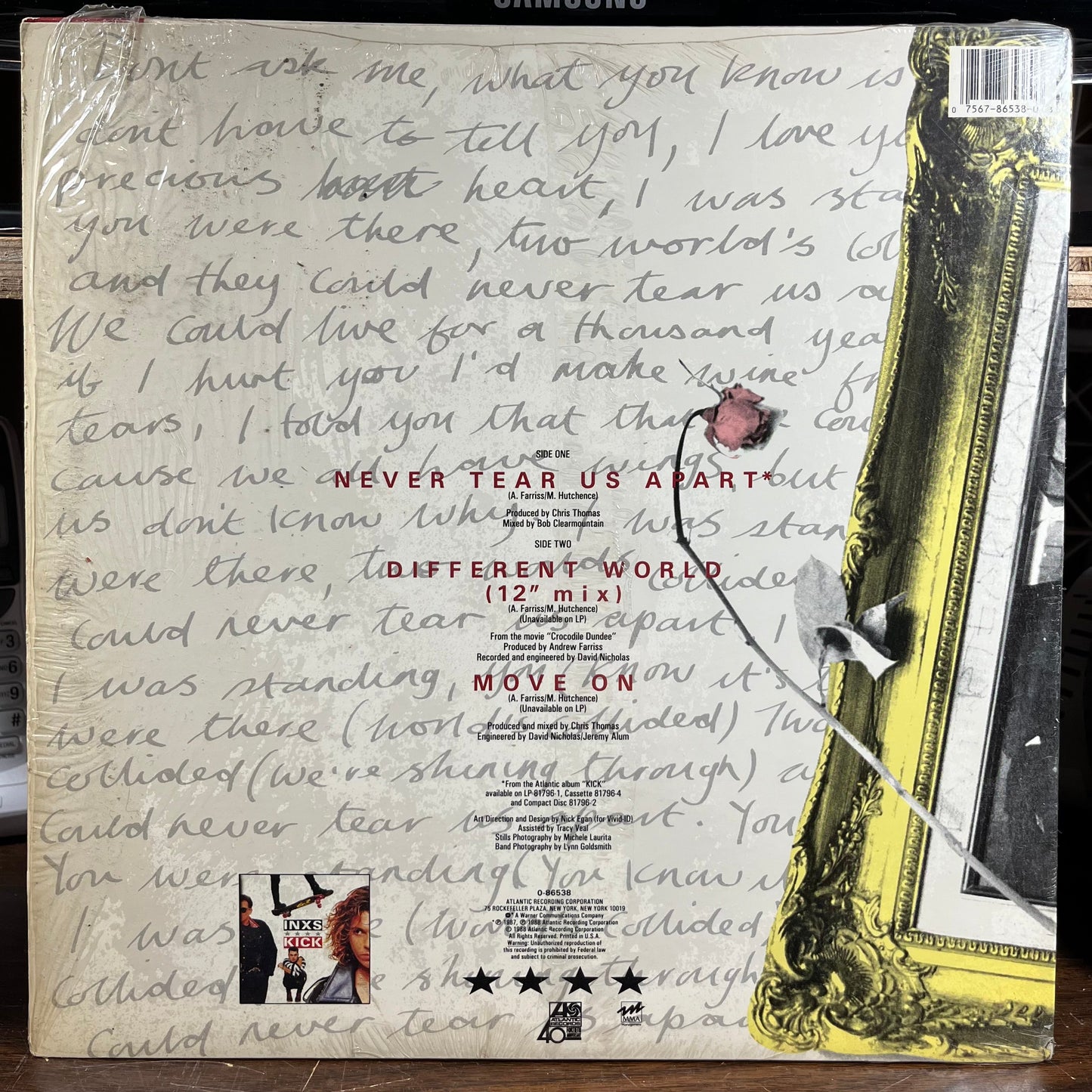 Never Tear Us Apart (VINYL) | Very Good Plus (VG+) Near Mint (NM) Get Cheap Vinyl