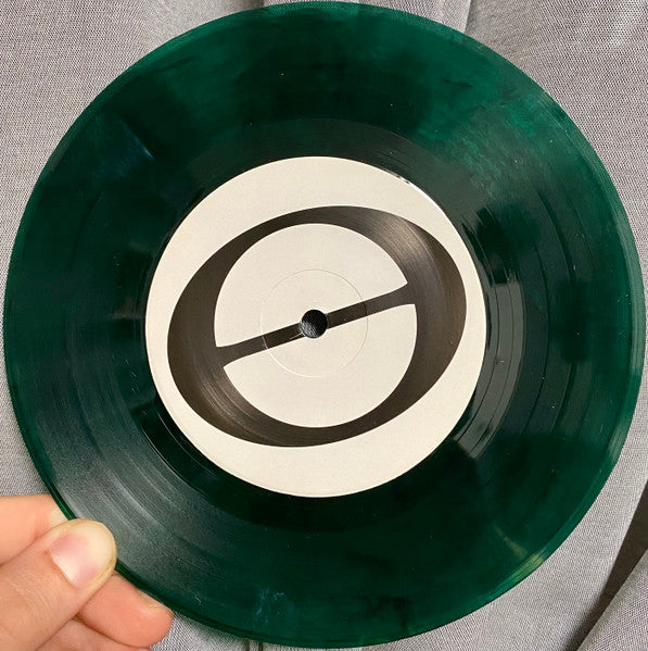 At Capacity (TRANSPARENT GREEN MARBLE VINYL 7") | Mint (M) Mint (M) Get Cheap Vinyl