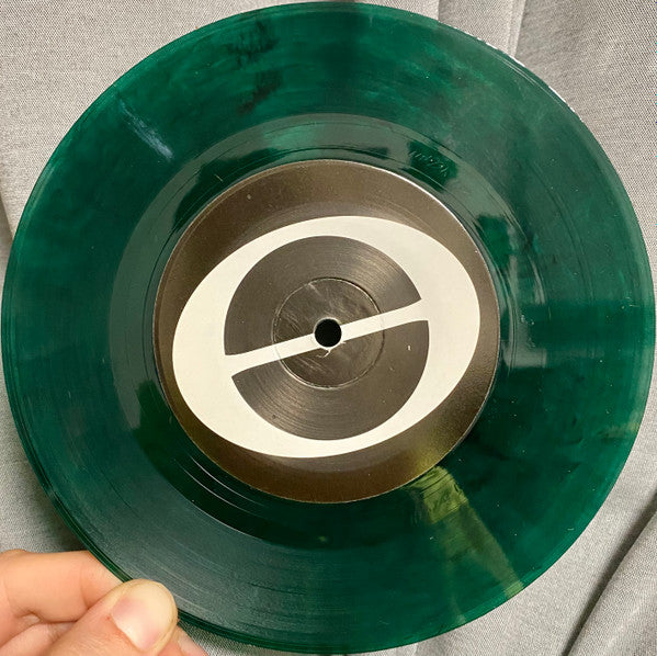 At Capacity (TRANSPARENT GREEN MARBLE VINYL 7") | Mint (M) Mint (M) Get Cheap Vinyl