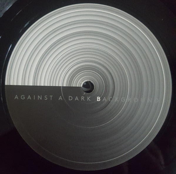 Against A Dark Background | Mint (M) Mint (M) Get Cheap Vinyl